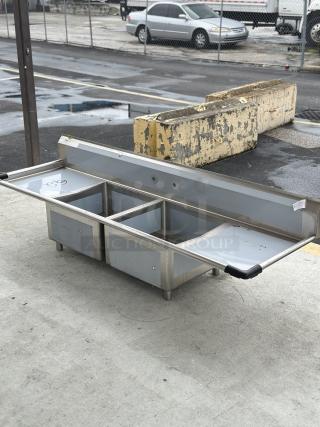 BRAND NEW! SCRATCH AND DENT! Regency - 16 Gauge Stainless Steel Two Compartment Sink with 2 Drainboards - 23