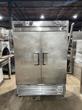 True Commercial Stainless Steel Solid 2 Door Reach In Refrigerator! Energy Star Certified! With Poly Coated Wire Rack! Model: T-49 SN: 8544988! 115V 1 Phase! On Casters! WORKING WHEN REMOVED!