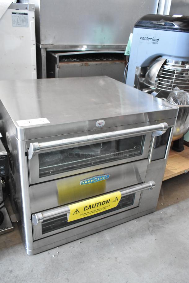 Stainless steel TurboChef commercial oven, dual-door, caution label visible, used condition.