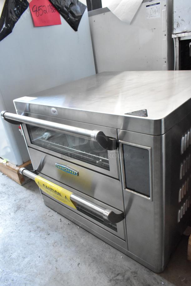 TurboChef stainless steel oven, double handles, clear door, caution label. Model visible, condition appears good.