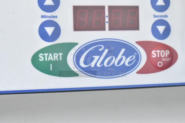 Close-up of Globe control panel with digital display, start and stop buttons, and timer adjustment for minutes and seconds.