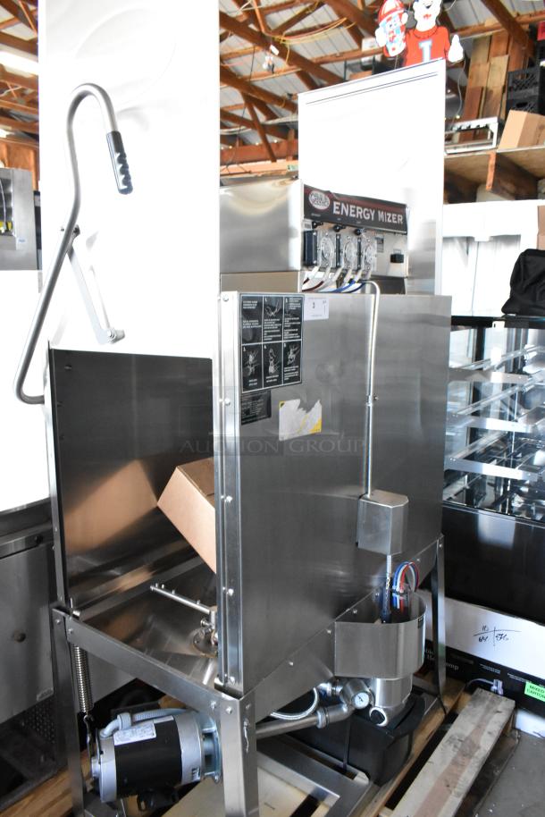 Stainless steel Energy Mizer commercial dishwasher, used condition, visible labels for operating instructions and controls.