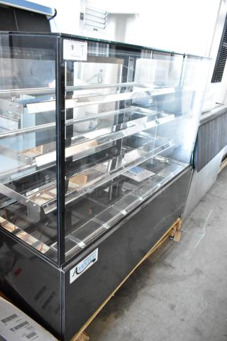Avantco refrigerated display case, glass shelves, black exterior, good condition, item label visible, used for food presentation.