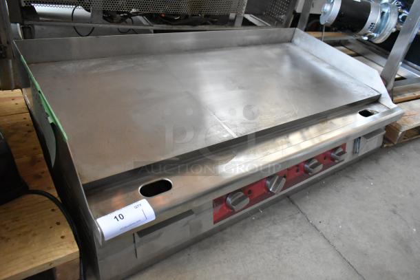 Commercial stainless steel griddle with manual controls, in good condition, marked "10" from auction.