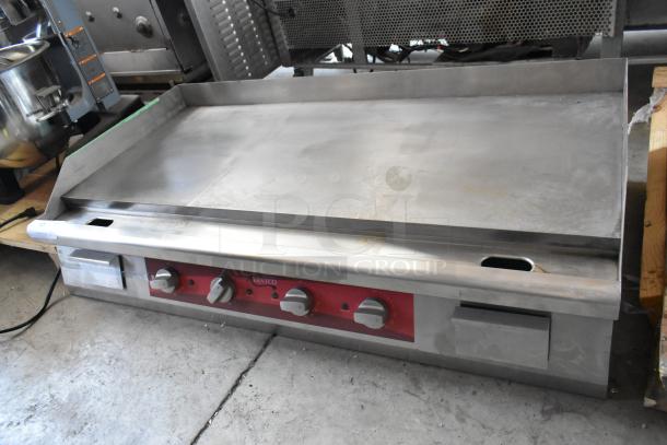 Vulcan commercial griddle, stainless steel, three control knobs, used condition, model details on red panel.