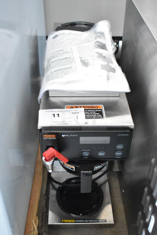 Bunn Axiom coffee maker with manual, black and stainless steel, warning labels visible. In good condition.
