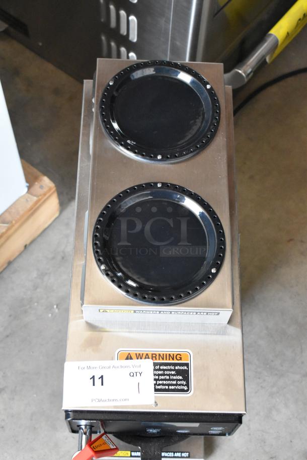 Commercial double burner warmer, stainless steel, with visible warning label and auction lot number tag. Good condition.
