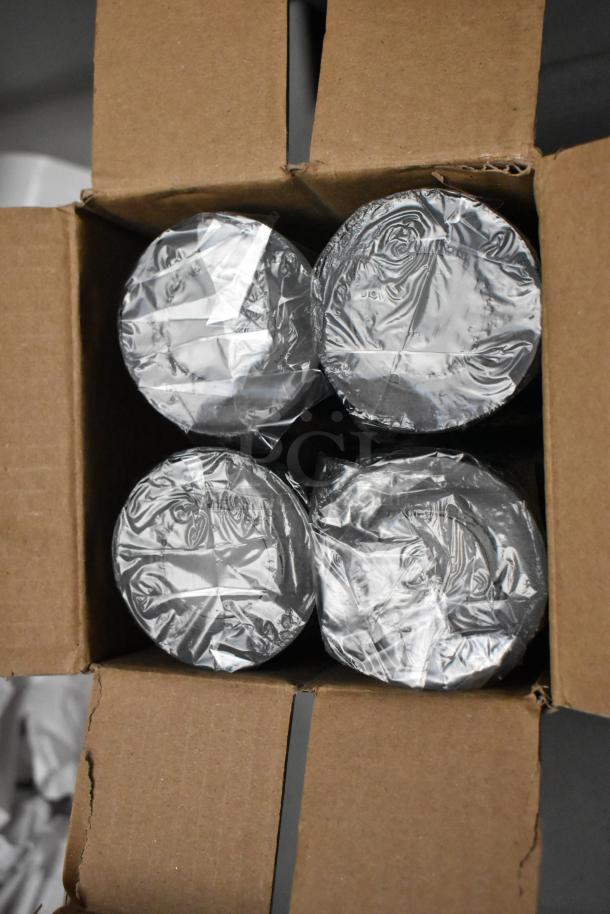 Four rolls of film sealed in plastic, inside a cardboard box. Appears unused, with no visible markings or labels.