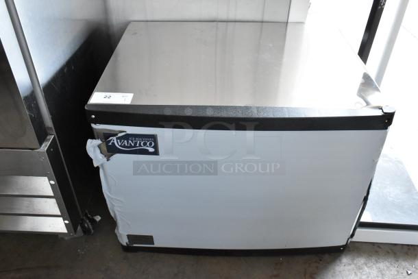 Avantco ice machine, visible wear, model sticker on front, white exterior, stainless steel top, auction tag number 22.