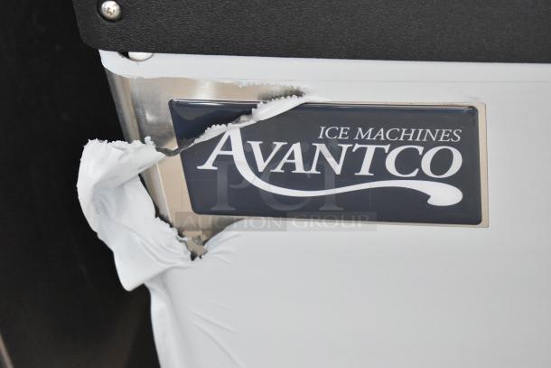 Avantco ice machine with damaged exterior panel, showing label.