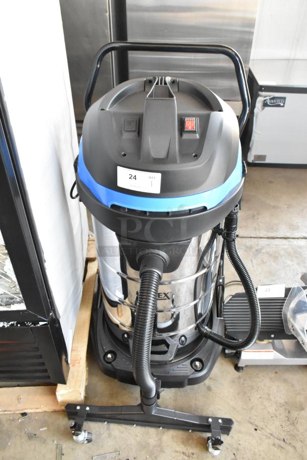 Industrial vacuum cleaner, stainless steel body, black and blue accents, wheeled base, condition appears used. Label: "24 QTY 1".