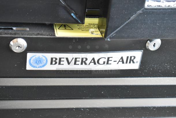 Beverage-Air commercial cooler, black, featuring lock mechanism and visible brand label, in good condition.