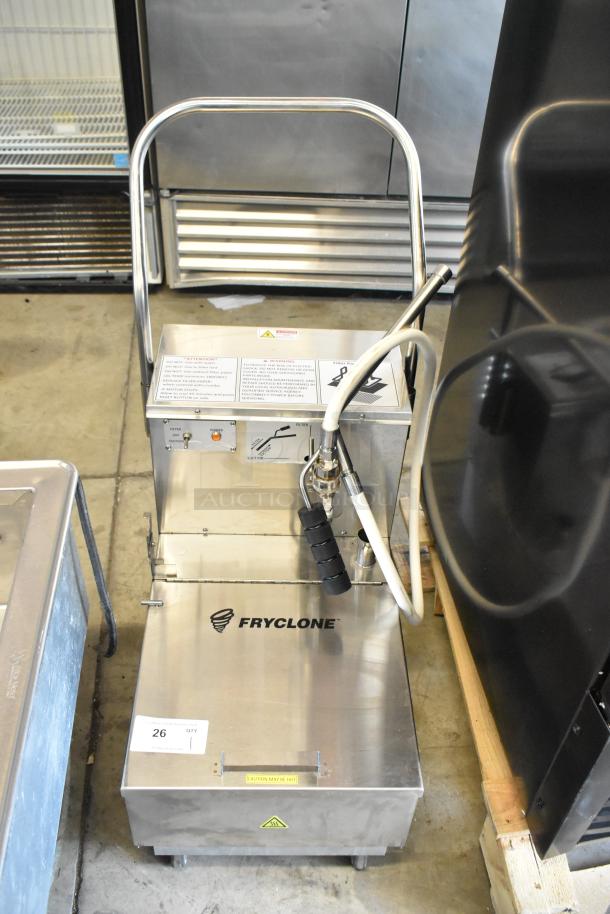 Fryclone oil filtering machine with hose, stainless steel finish, warning labels, and model number 26. Used condition.