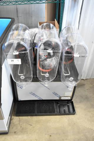 Narvon beverage dispenser with three clear containers, each with spouts. Labels indicate "Max Fill Level." Appears unused.