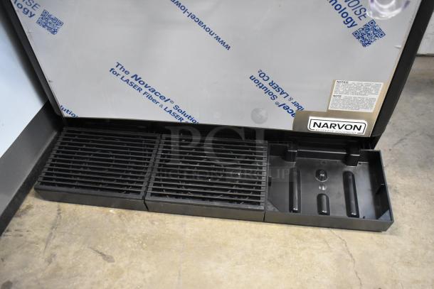 Narvon beverage equipment drip tray with black slotted design, labeled with brand name. Good condition, suitable for commercial use.