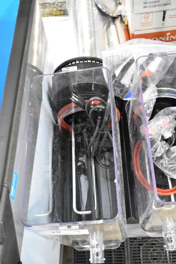 Commercial coffee dispenser parts, including clear container, spout, and heating elements. Appears unused. Labels indicate maintenance info.