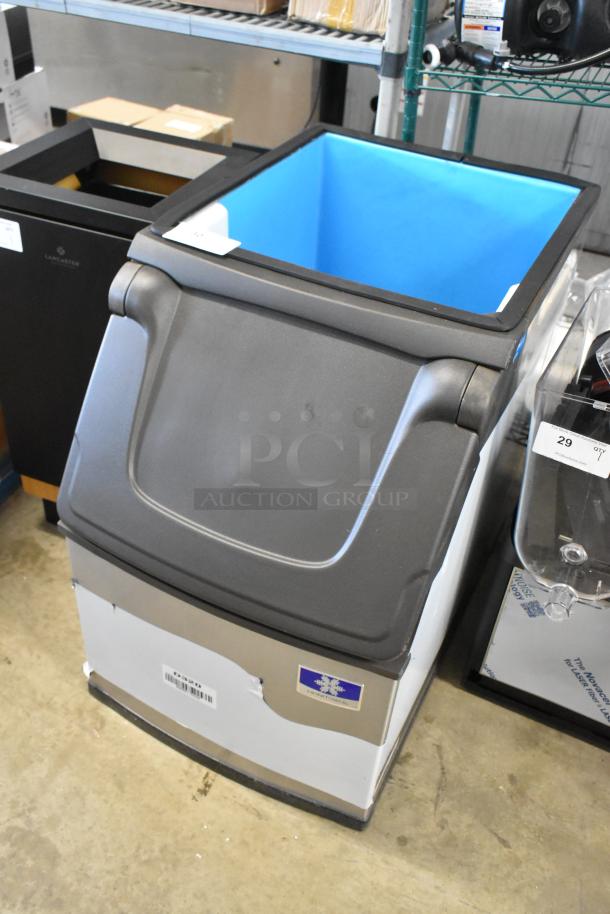 Commercial ice maker with black lid and blue interior. Features brand label "Hoshizaki". Excellent condition.