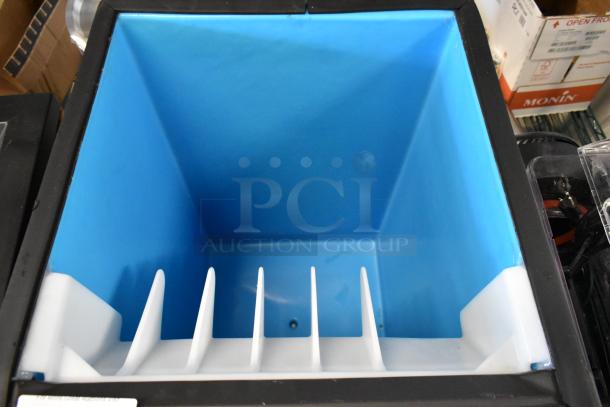 Ice bin with blue interior and white dividers, clean condition, suitable for commercial or home use.