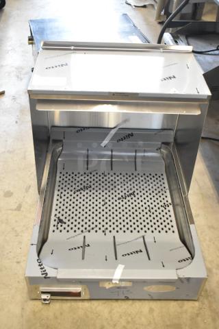 Commercial stainless steel grill or cooking appliance with Nitto protective film. Like-new condition, no visible wear.