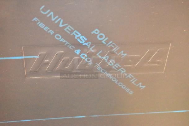 Polifilm Universal Laser Film, marked for fiber optic and CO2 technologies, embossed branding on surface.