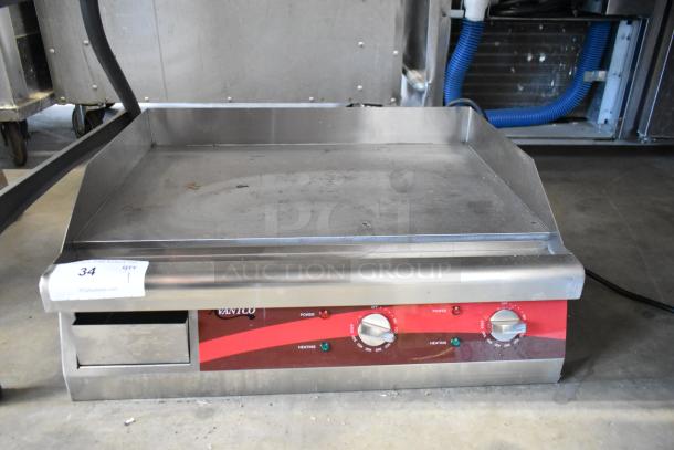 Avantco commercial griddle with dual controls, stainless steel surface, shows signs of wear, auction tag number 34 visible.