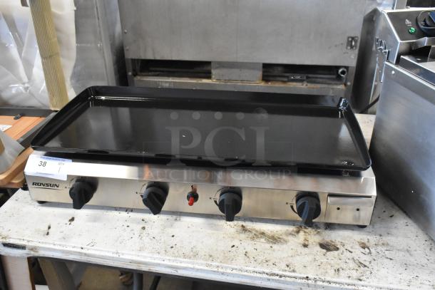 Rovsun stainless steel griddle with four knobs, excellent condition, model 38 visible on label, auction item on metal table.