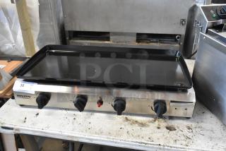 Rovsun stainless steel griddle with four knobs, excellent condition, model 38 visible on label, auction item on metal table.