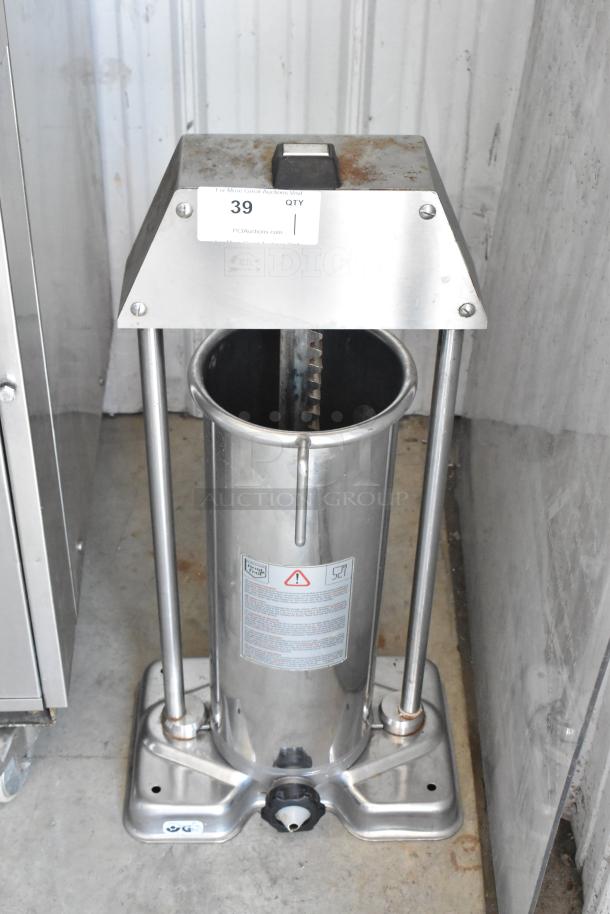 Stainless steel vertical sausage stuffer, model F. Dick, with visible rust and wear. Auction tag 39, good condition overall.
