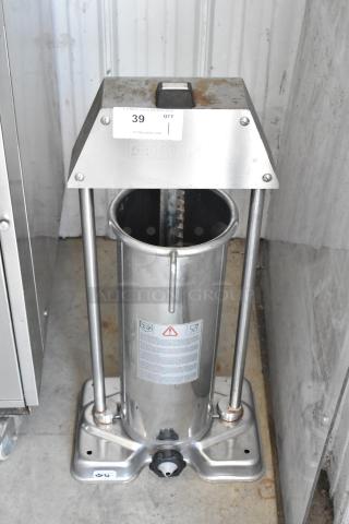Stainless steel vertical sausage stuffer, model F. Dick, with visible rust and wear. Auction tag 39, good condition overall.