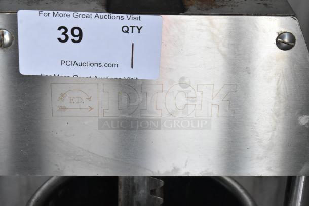 Stainless steel appliance with "DICK" branding etched, showing auction tag "39," minor surface scratches visible.