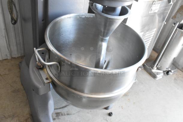 Commercial stainless steel dough mixer, large capacity bowl, funnel attachment, gray base, good used condition.