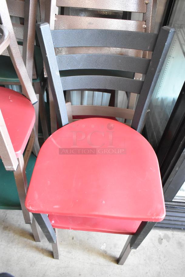 Metal dining chair with a red seat and ladder-back design, showing minor wear. Suitable for commercial or personal use.