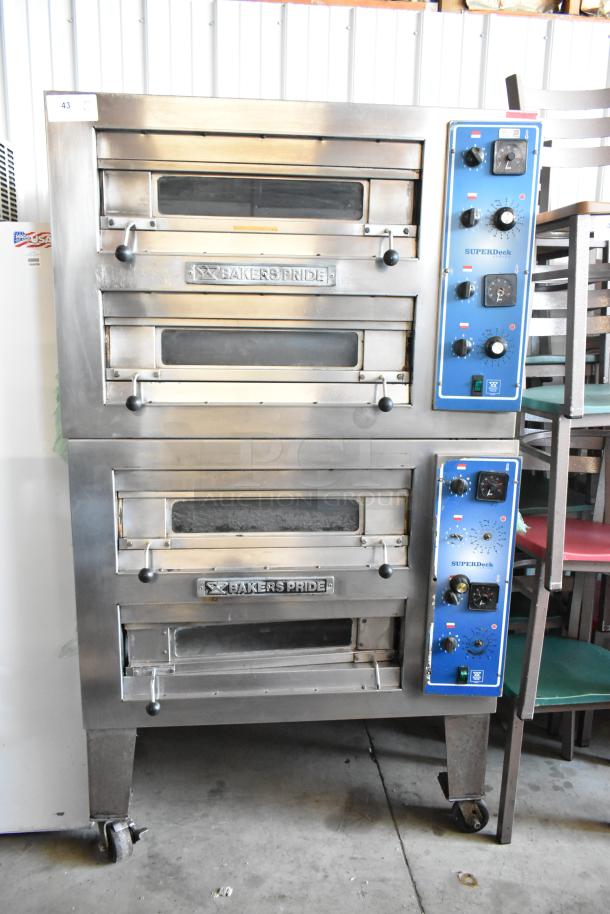 Bakers Pride SuperDeck double-deck pizza oven, stainless steel, blue control panels, used condition, visible brand logo.