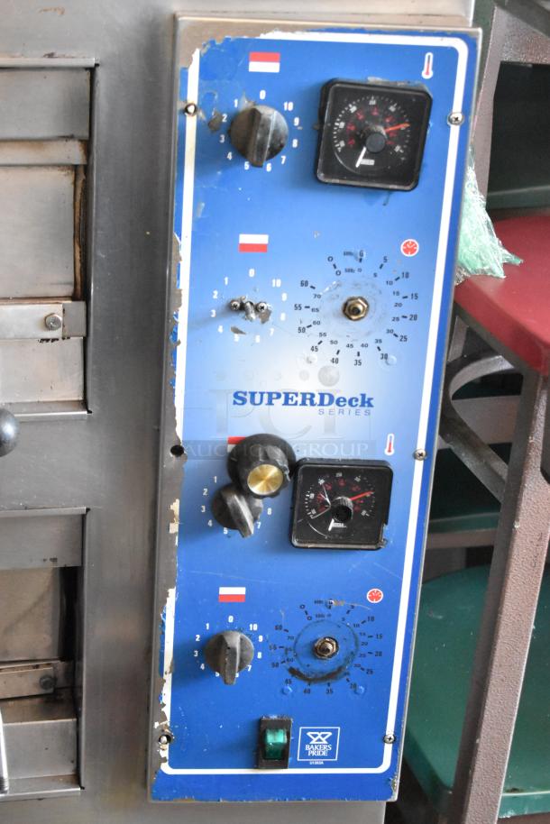 Baker's Pride SuperDeck oven control panel with dials, gauges, and visible wear. Model tag UT130A.