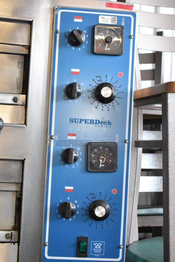 Bakers Pride SUPERDeck oven control panel, blue with multiple dials and gauges, marked U1355A, in good condition.