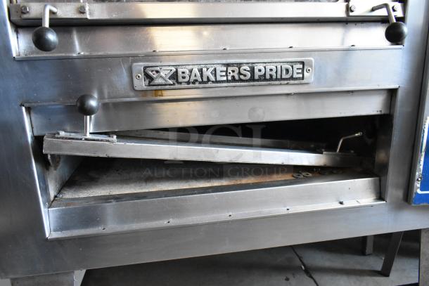 Baker's Pride commercial pizza oven, stainless steel, dual control knobs, visible brand plate, signs of use, good condition.