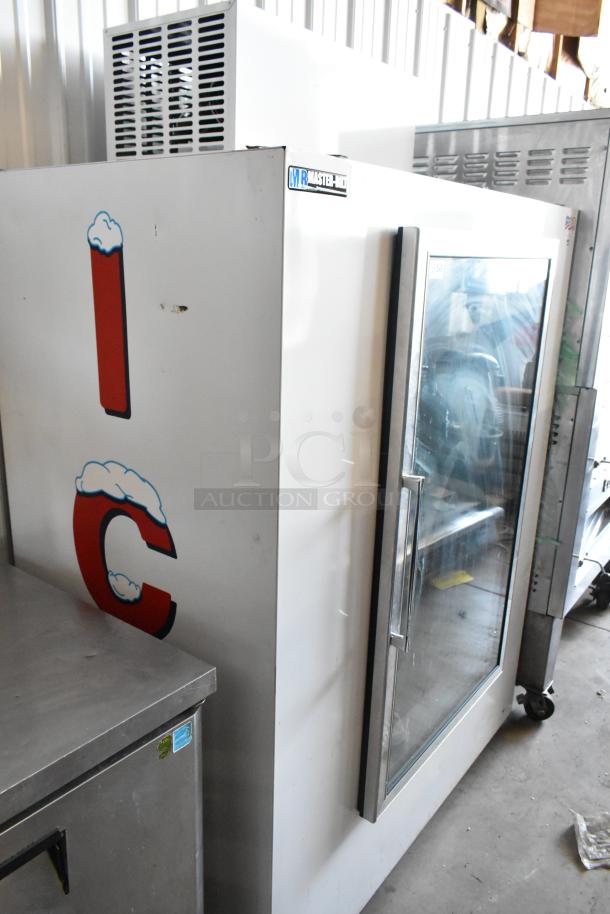 White commercial ice merchandiser with glass door, Master-Bilt label, and "IC" graphic. Used condition, sturdy construction.