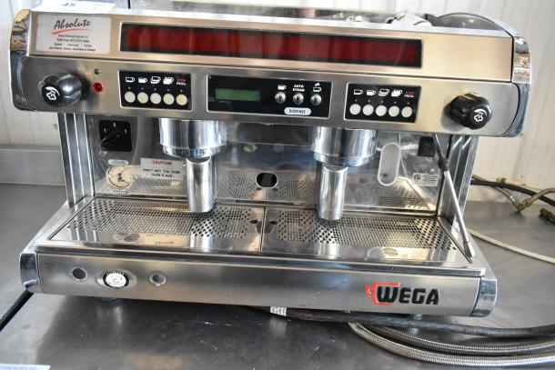 Wega espresso machine, stainless steel, dual group heads, programmable buttons, gauge, caution label, used condition.
