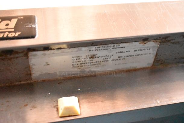 Delfield refrigerator model ST448N, serial BCX607911-T. Requires 115V, uses R-404A refrigerant. Good used condition.