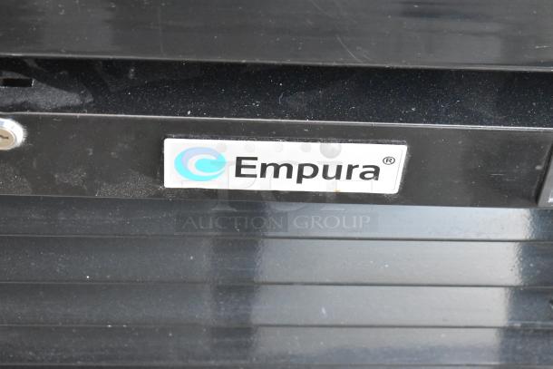 Empura refrigeration unit, black exterior with logo label. Slight wear visible on surface.