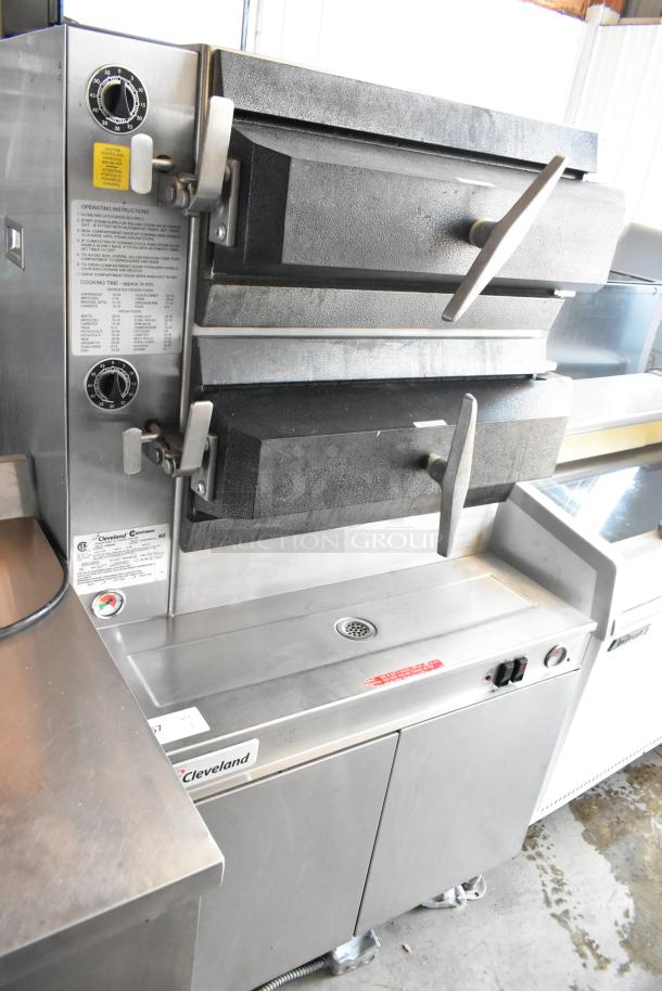 Cleveland steamer oven, stainless steel, dual compartments, manual controls, visible operating instructions, used condition.