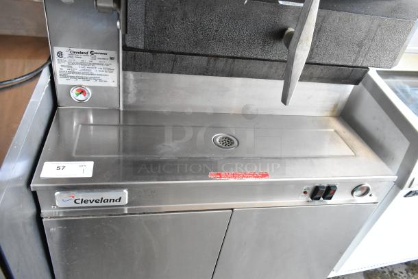 Cleveland steam cooker in stainless steel, model marked with manufacturer's label. Features include control knobs and drainage. Appears in good condition.
