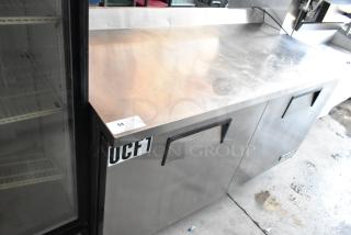 Stainless steel commercial undercounter freezer, 2-door, model UCF1, with visible label "58," in good condition.