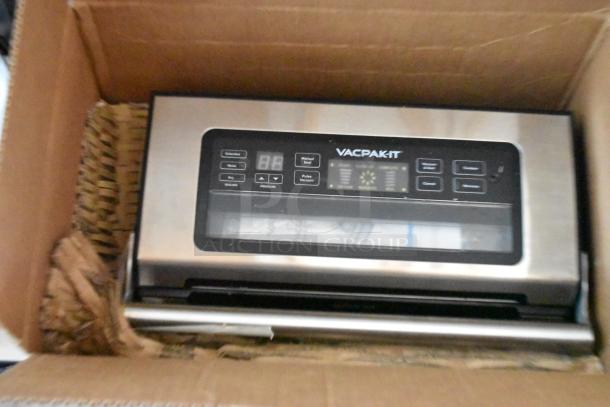 VACPAK-IT vacuum sealer in box, stainless steel finish, digital display, multiple seal options, new condition.
