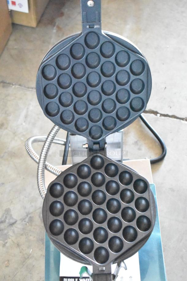 Bubble waffle maker with non-stick plates, open position, showing bubble pattern design. Suitable for commercial use.