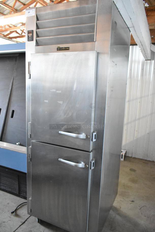 True Refrigeration stainless steel commercial freezer with dual doors, clean exterior, digital display, auction tag number 64.