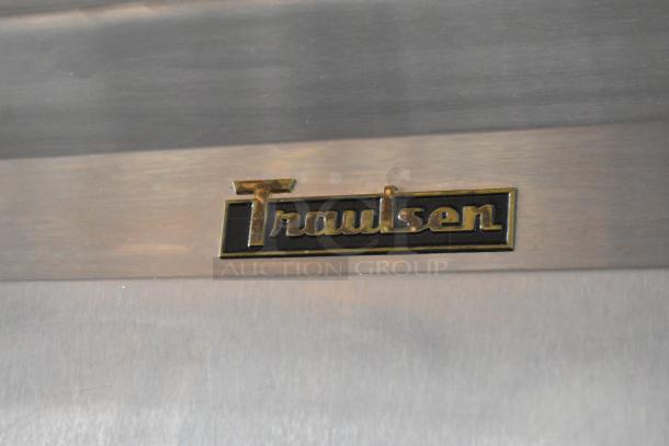 Traulsen stainless steel appliance with embossed brand logo. Excellent condition, ideal for commercial kitchen use.