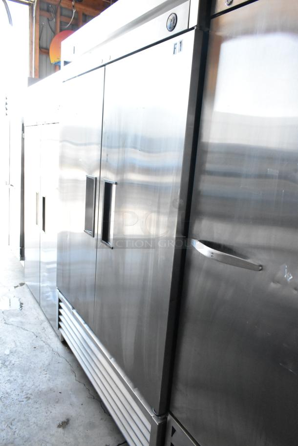 Stainless steel commercial refrigerator with double doors, model F1, industrial handle, good condition.