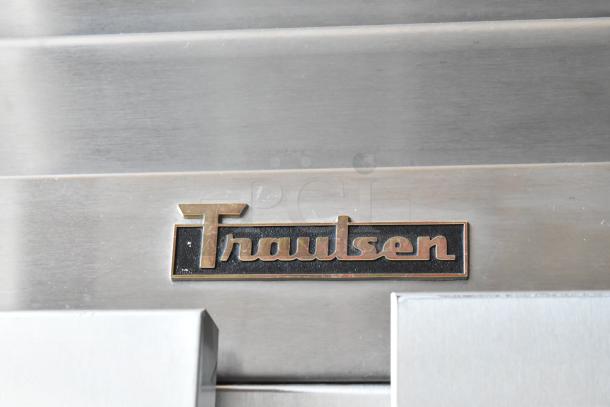 Traulsen commercial refrigerator nameplate, metal surface, clean and well-maintained condition.