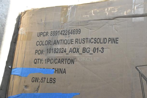 Cardboard box marked with "Antique Rustic Solid Pine," UPC 889142264699, PO 10182024_AOX_BG_01-3, weight 57 lbs.